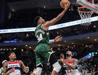 Giannis Antetokounmpo as he is attempting a layup 