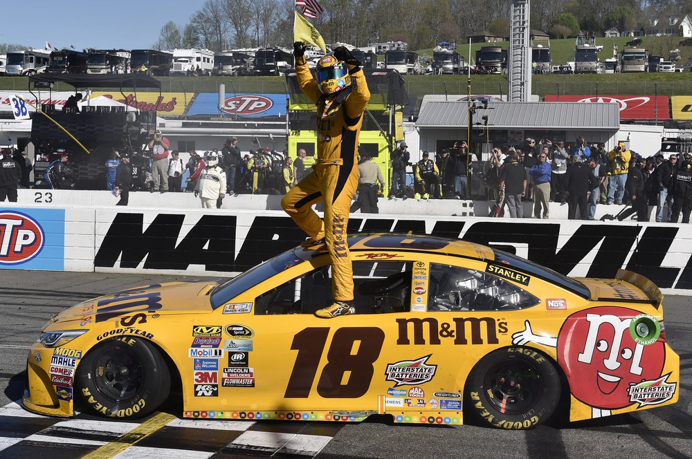 Kyle Busch celebrates his win at Martinsville in April 2016. Photo via Motorracingdigest.com