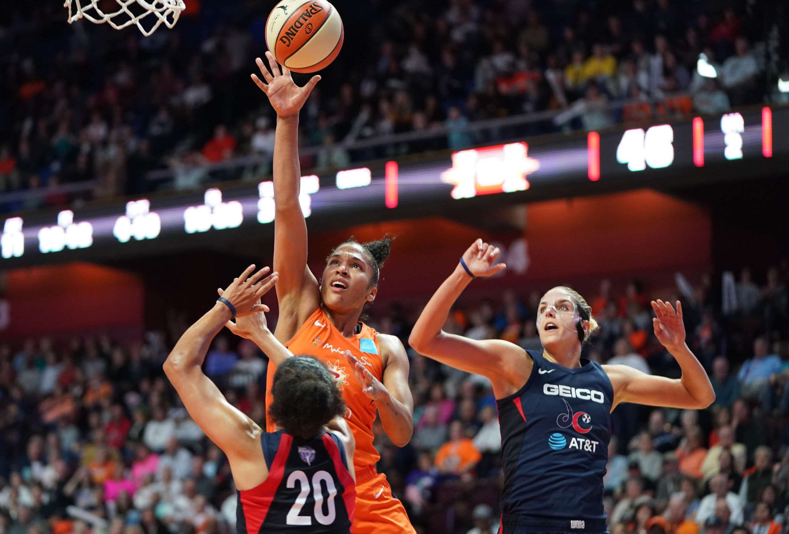 Oct 8, 2019; Uncasville, CT, USA; Connecticut Sun forward Alyssa Thomas (25) shots against Washington Mystics guard Kristi Toliver (20) and forward Elena Delle Donne (11) during the second quarter in game four of the 2019 WNBA Finals at Mohegan Sun Arena. Mandatory Credit: David Butler II-USA TODAY Sports