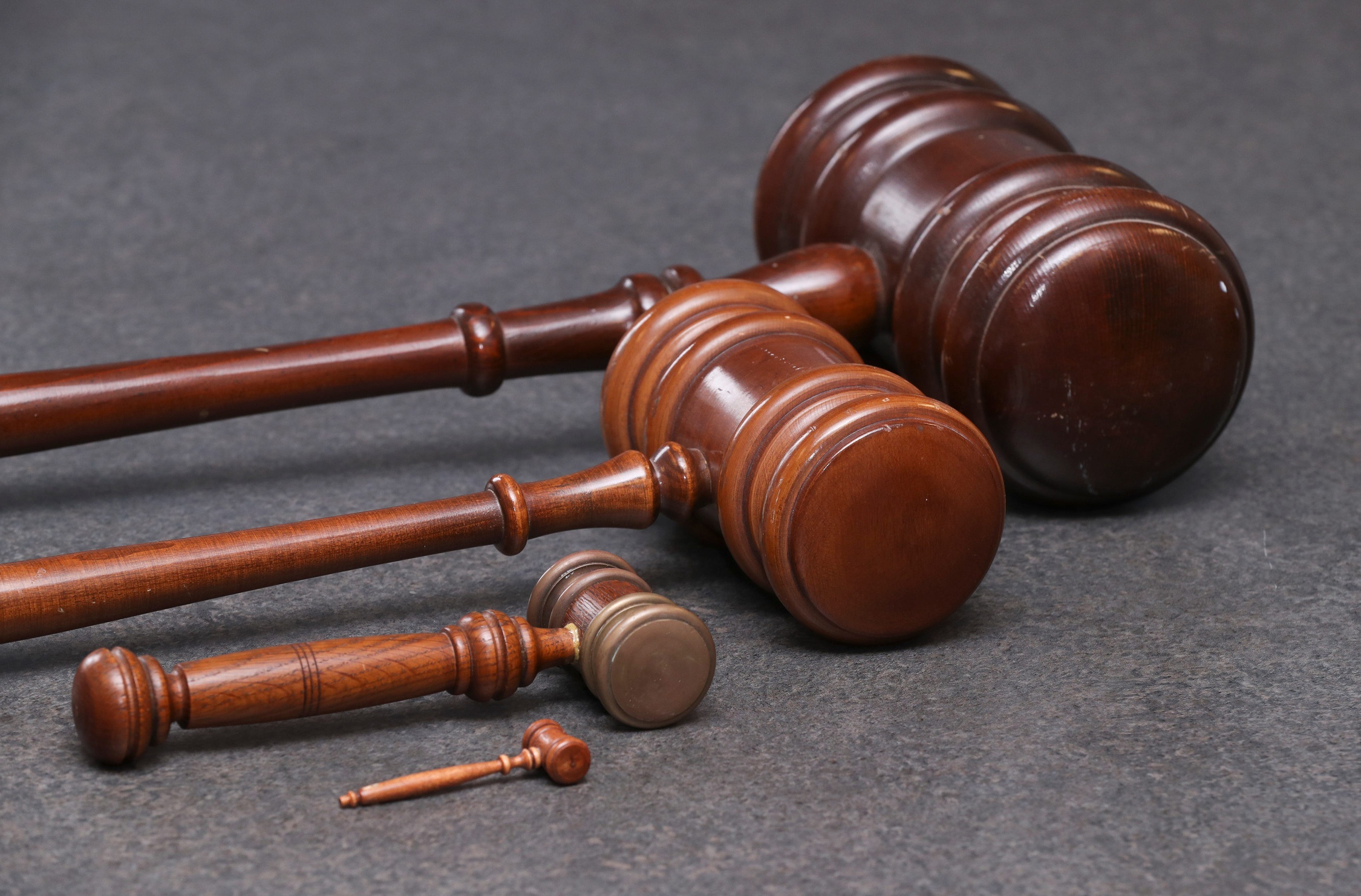 An array of gavels are pictured.