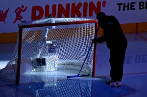 An empty ice hockey net is seen.