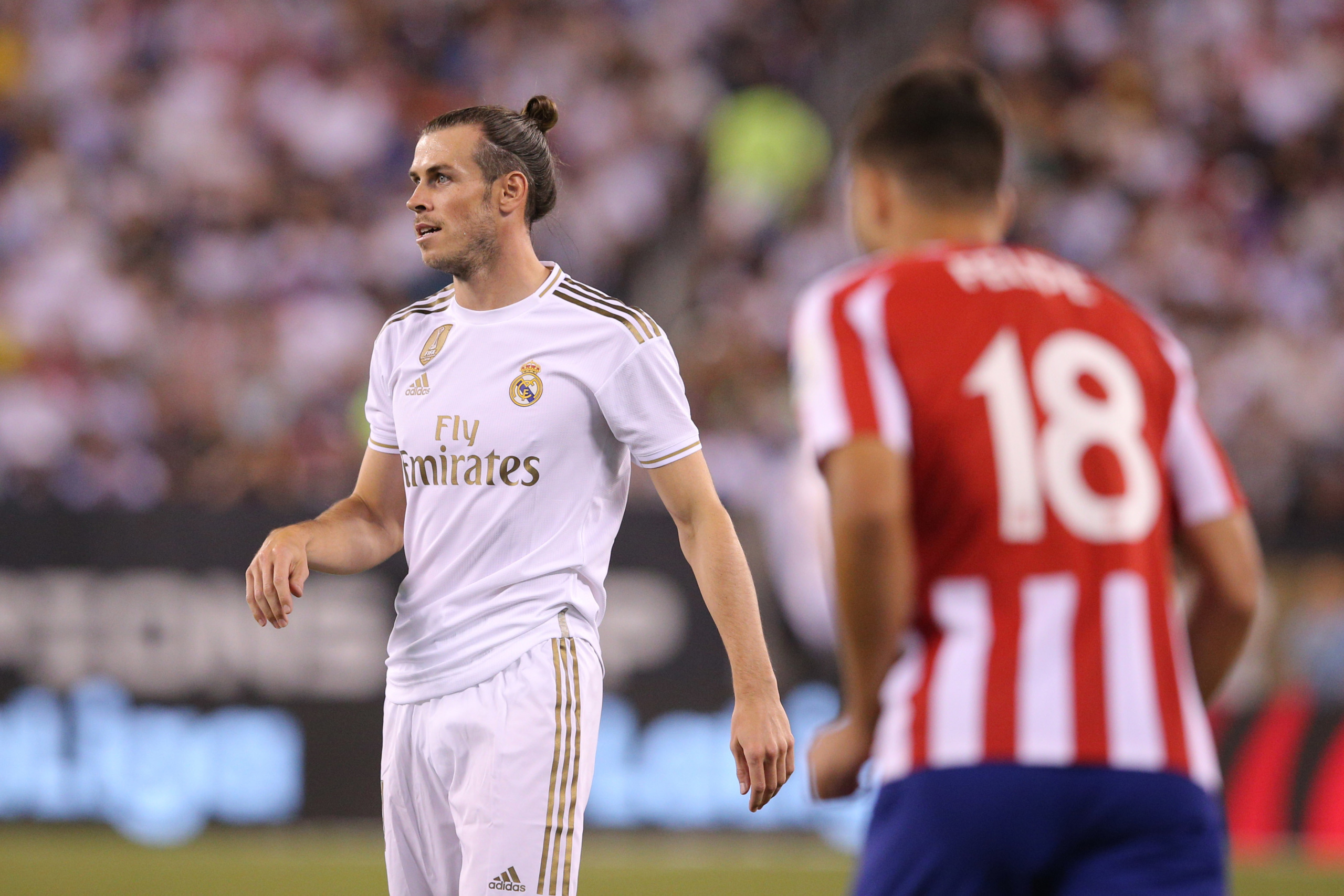 two_men_playing_soccer