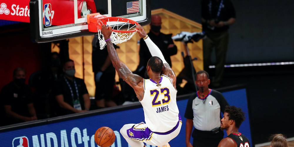 LeBron James dunks in NBA Game.