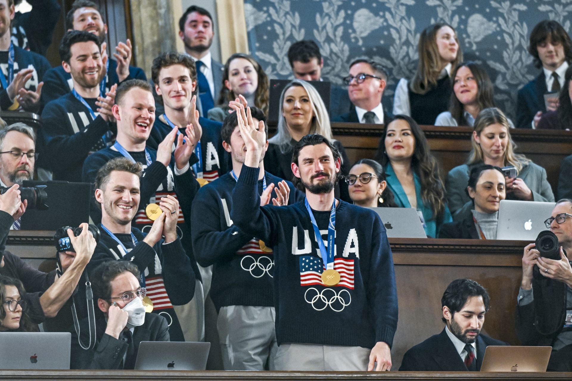 Feb 24, 2026; Washington, DC, USA; The United States Olympic Men’s Ice Hockey Team, Connor Hellebuyck in front, as President Donald J. Trump delivers the first State of the Union address of his second term to a joint session of Congress in the House Chamber of the United States Capitol in Washington on Tuesday