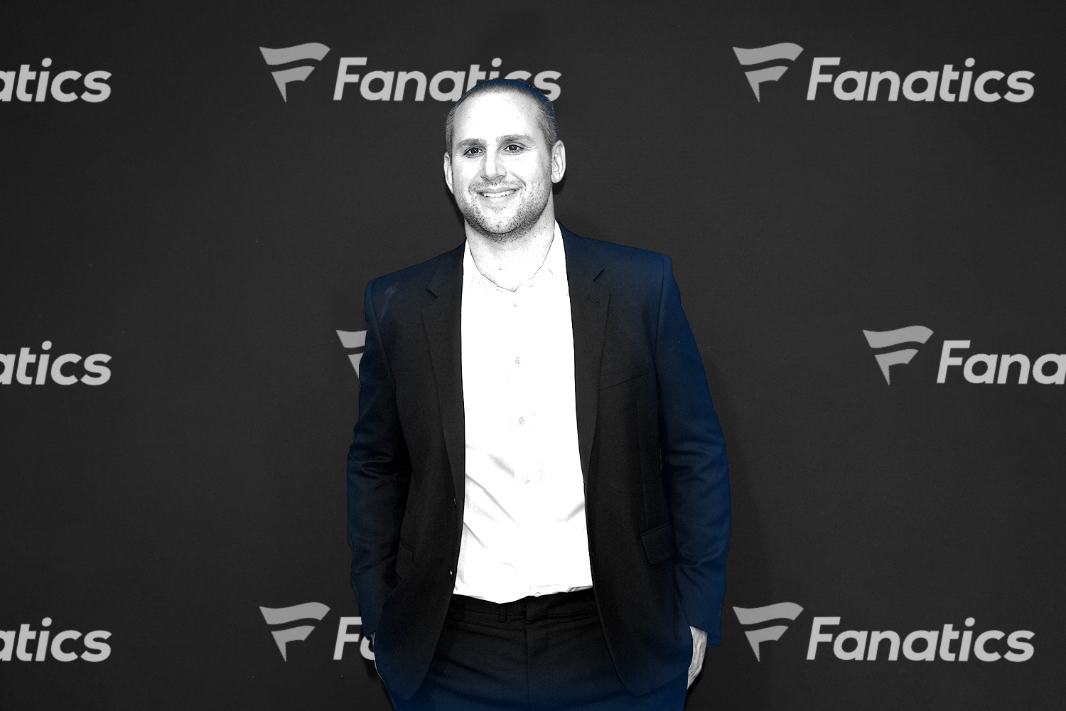 fanatics_logo_behind_man