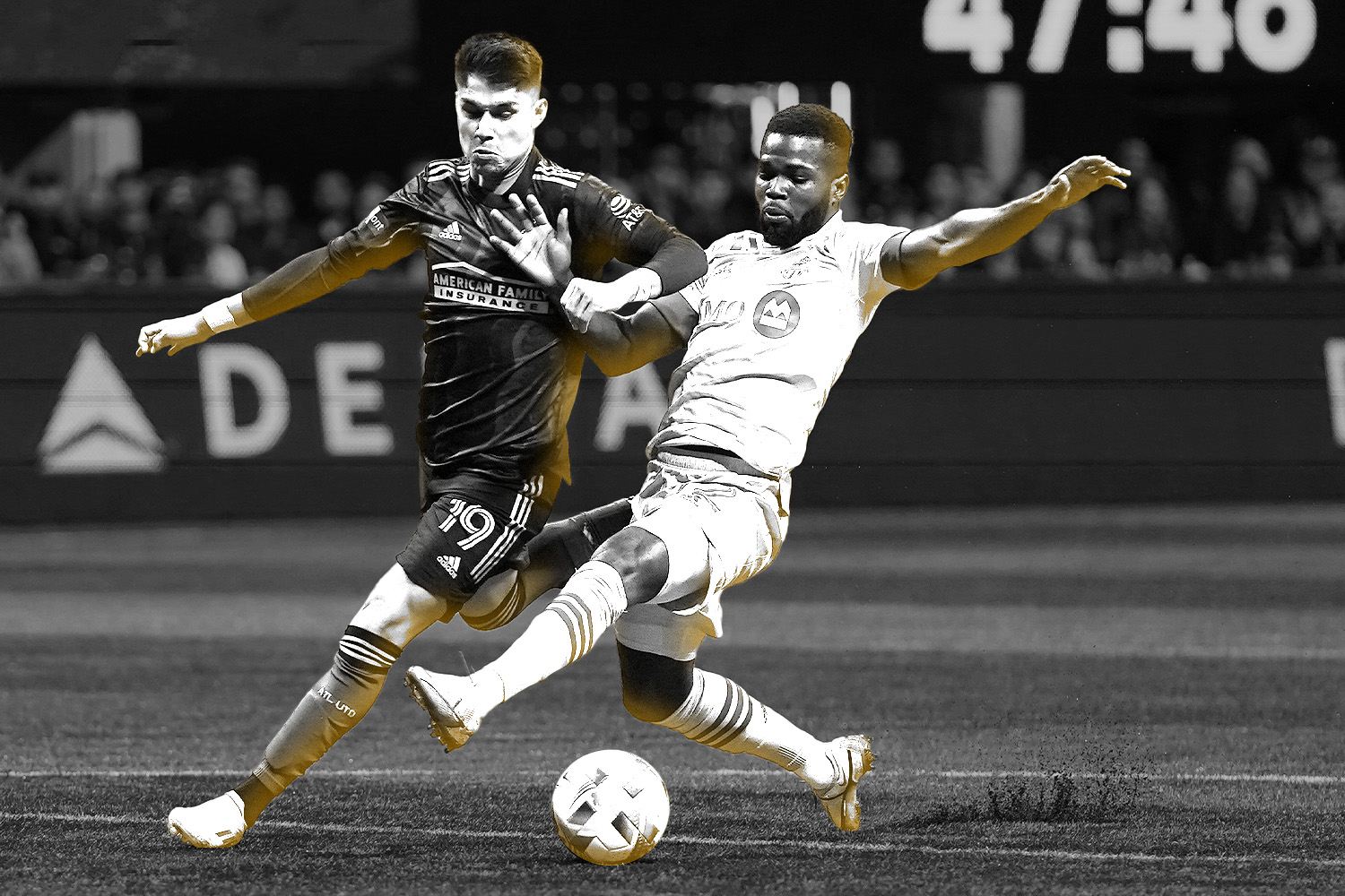 two_men_playing_soccer