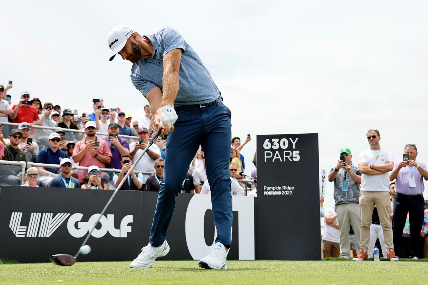 Dustin-Johnson-hits-ball-at-LIV-Golf-event