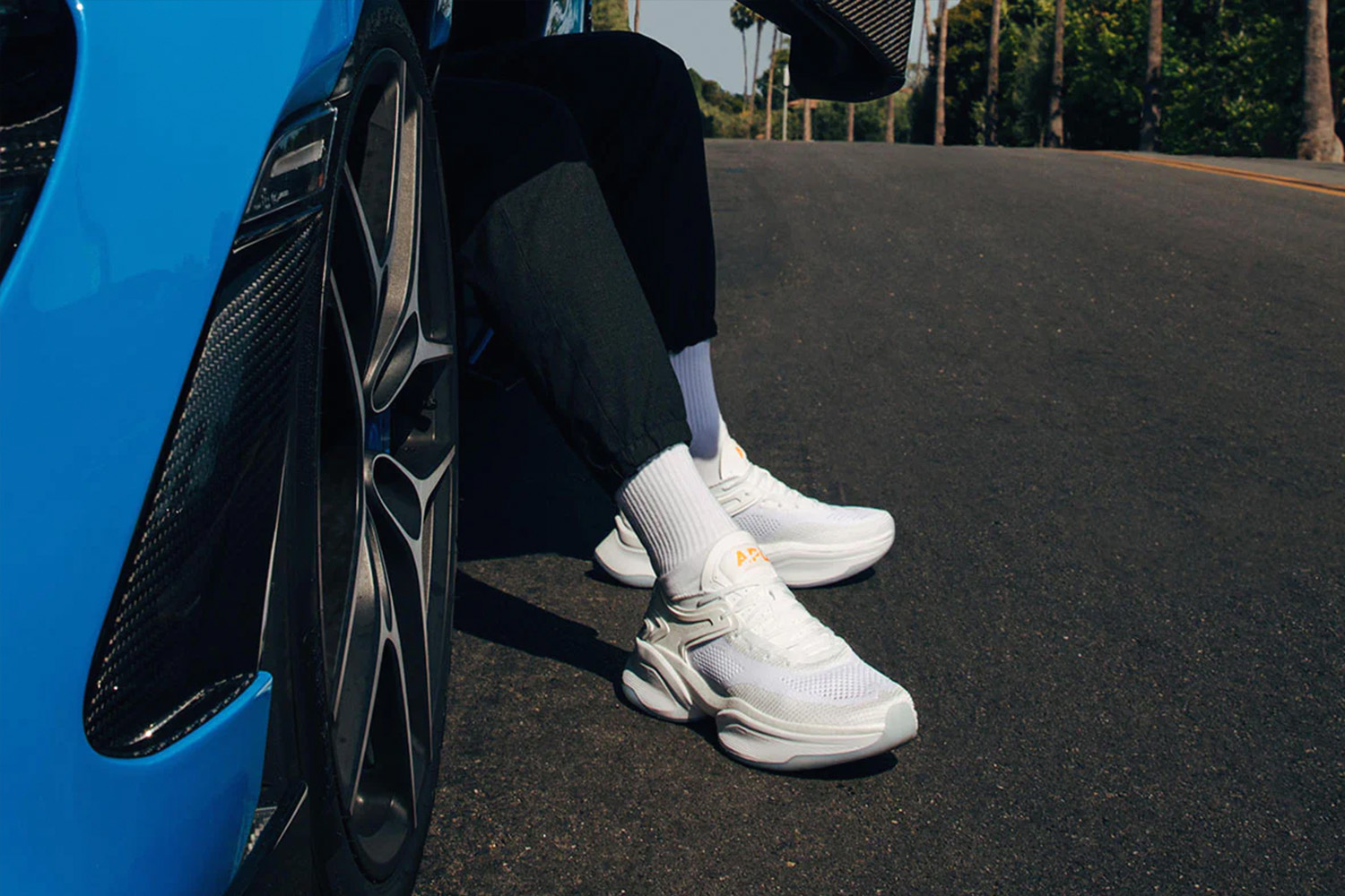 Person-getting-out-of-a-McLaren