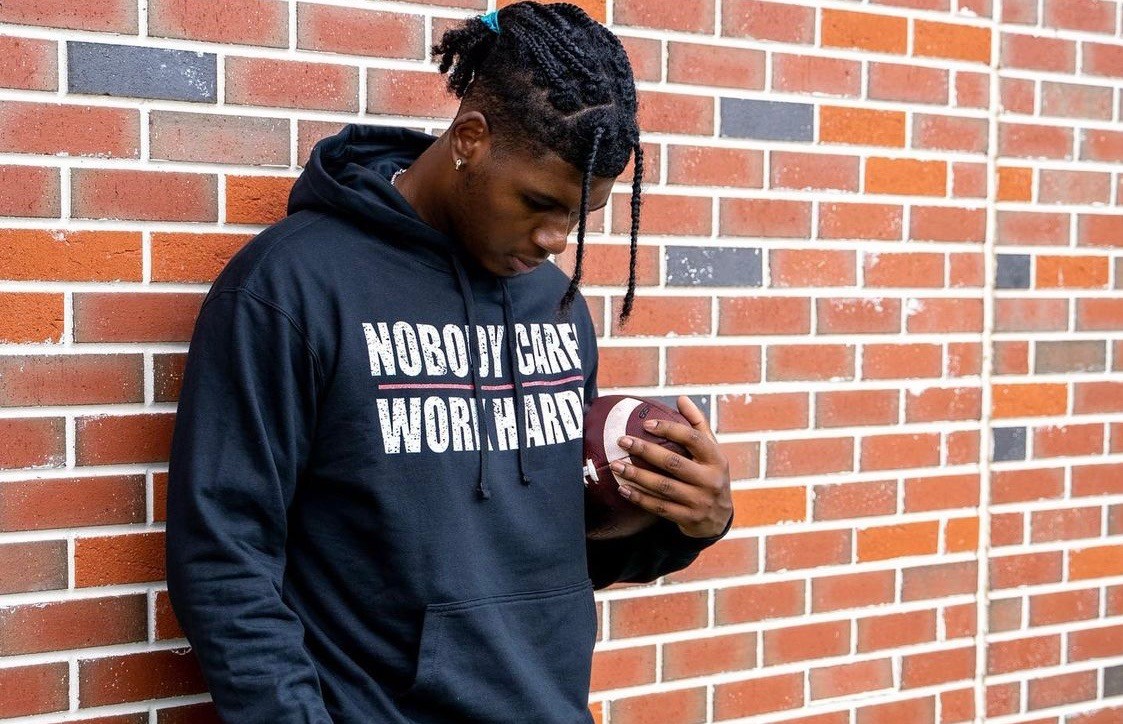 TJ-Finley-showcasing-merch-from-NIL-deal-with-Amazon