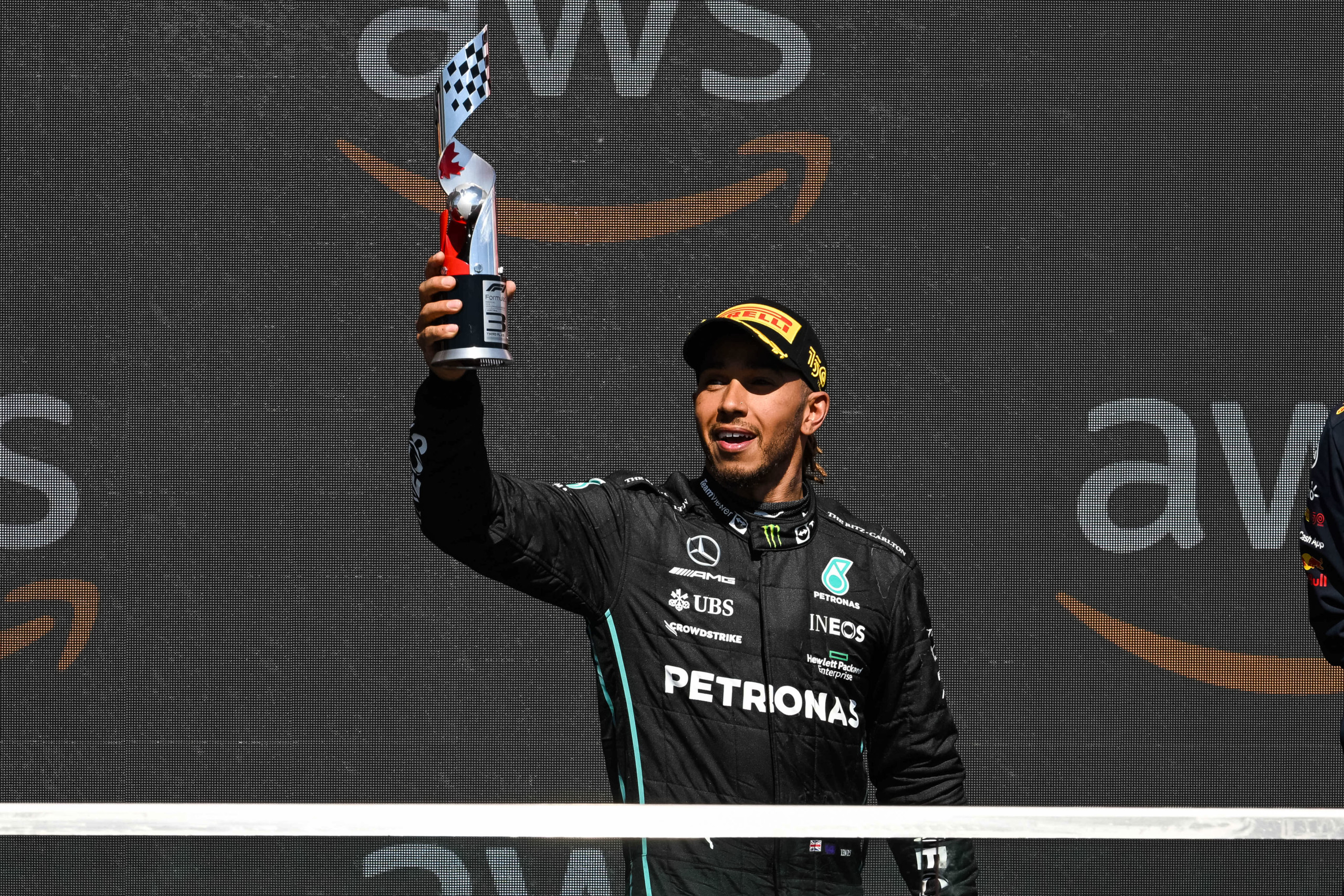 Sir-Lewis-Hamilton-holding-trophy