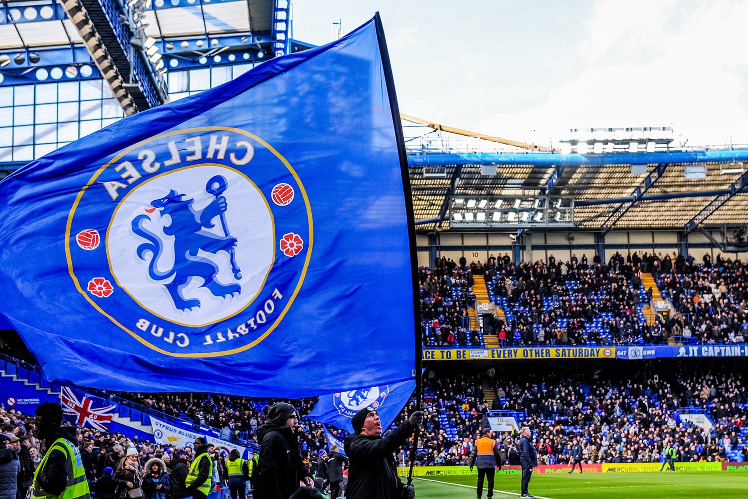 General view of Chelsea fans in front of a 'Cyprus Blues' banner