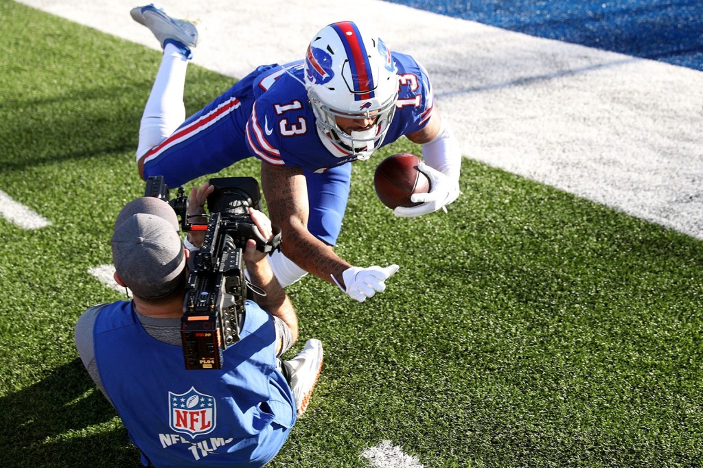 Bills receiver Gabe Davis completes diving catch in front of NFL camera man before game