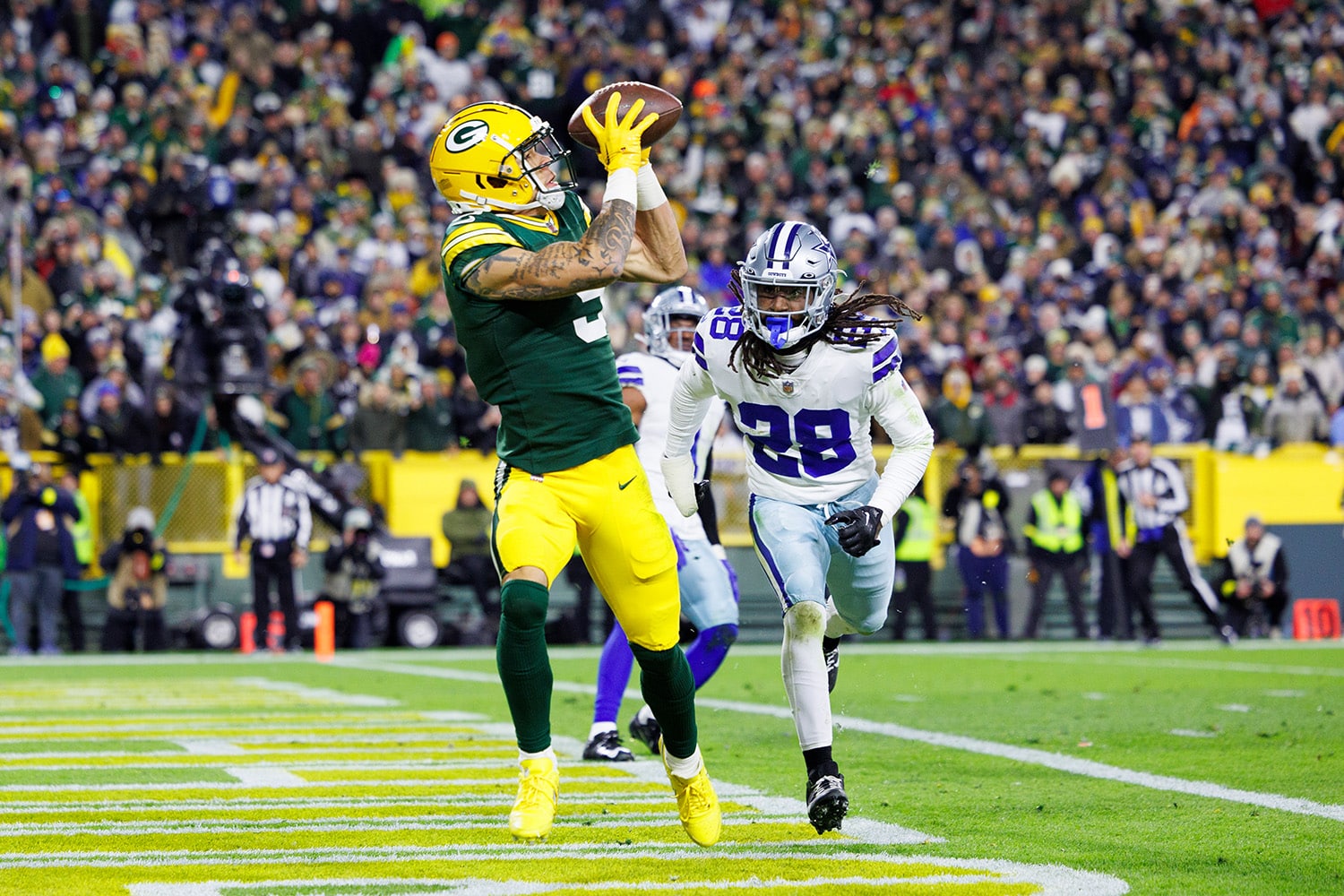 Packers rookie receiver Christian Watson catches touchdown against Dallas Cowboys during NFL game at Lambeau Field
