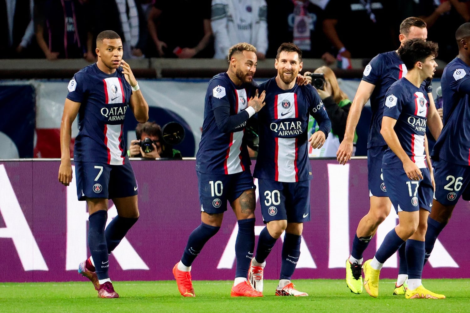 PSG players Messi, Neymar, and Mbappe celebrate with teammates after scoring goal