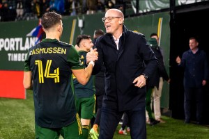 Portland Timbers and Thorns owner Merritt Paulson embraces Timbers player after game