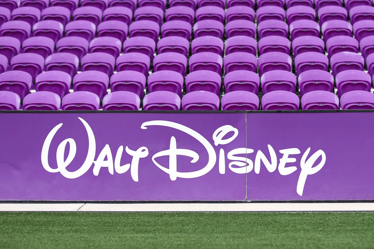 Walt Disney logo at pitch level inside stadium