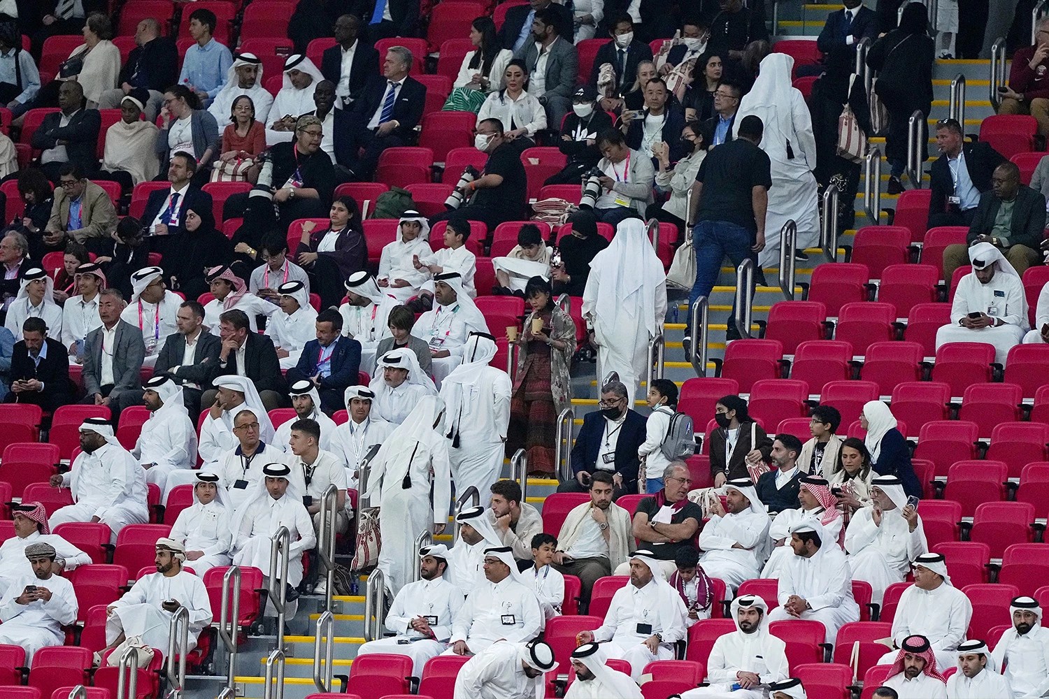 Fans wearing Thobes, the traditional dress of the Arabian Gulf region, while watching a World Cup match
