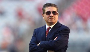 Washington Commanders owner Dan Snyder looking upset while crossing arms on sideline of NFL game