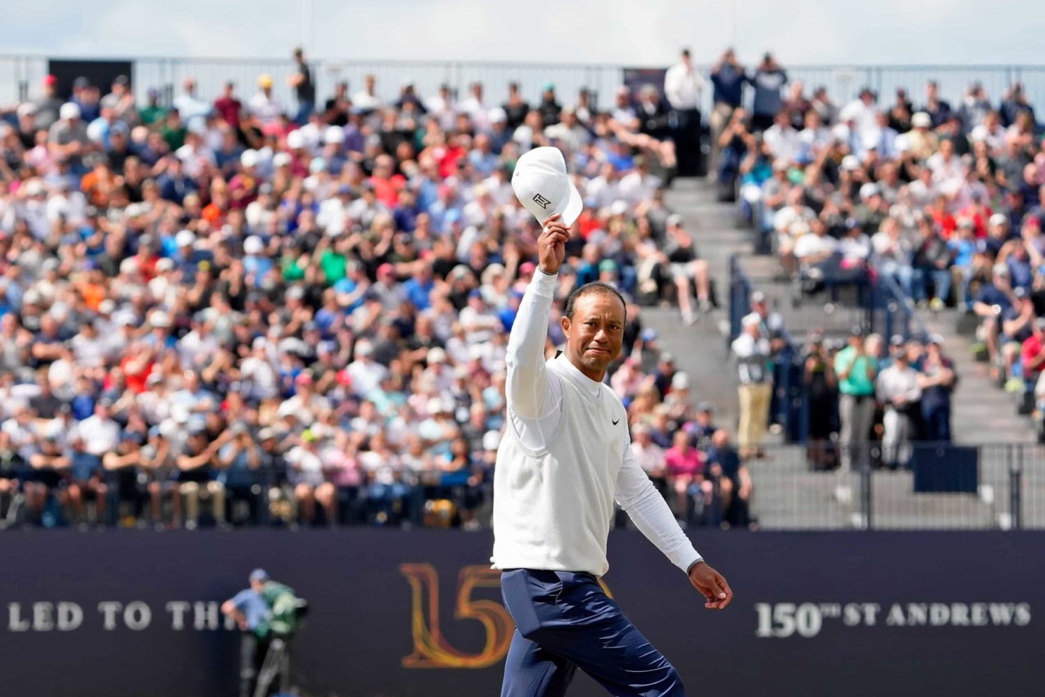 Tiger Woods raises cap to fans in appreciation after completing round during 150th Masters at St. Andrews