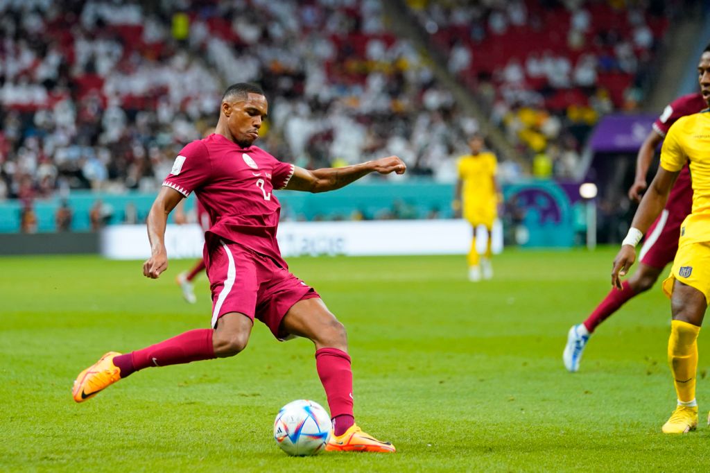 Qatar national team player attempts cross against Ecuador during World Cup match