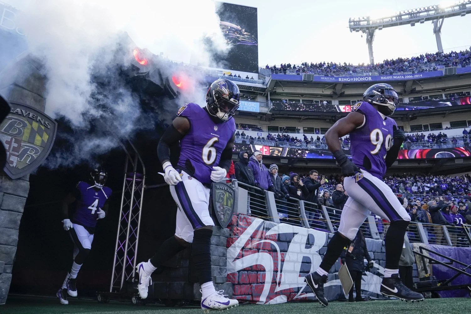 Baltimore Ravens team runs out of tunnel prior to NFL game