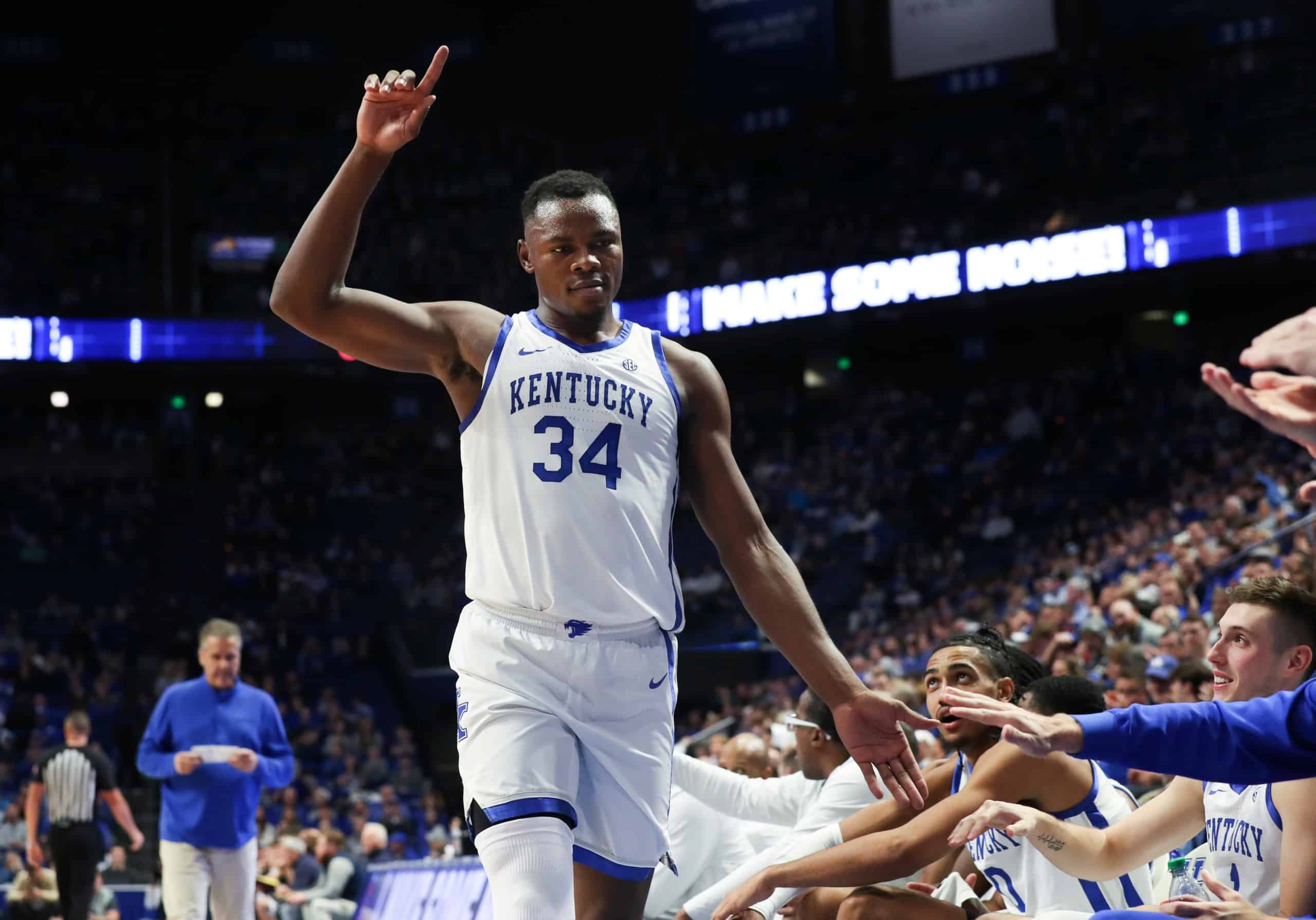 University of Kentucky guard Julius Mays celebrates with teammates on side line