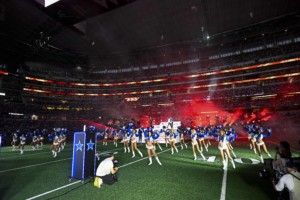 Dallas Cowboys cheerleaders perform at half-time of NFL game