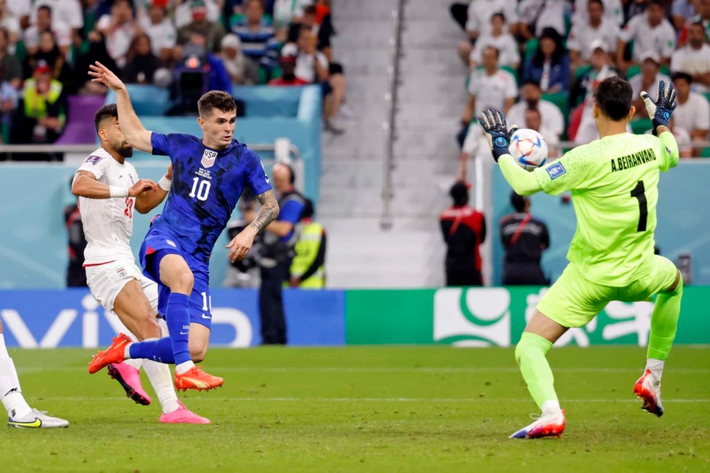 USMNT Christian Pulisic attempts shot during World Cup match