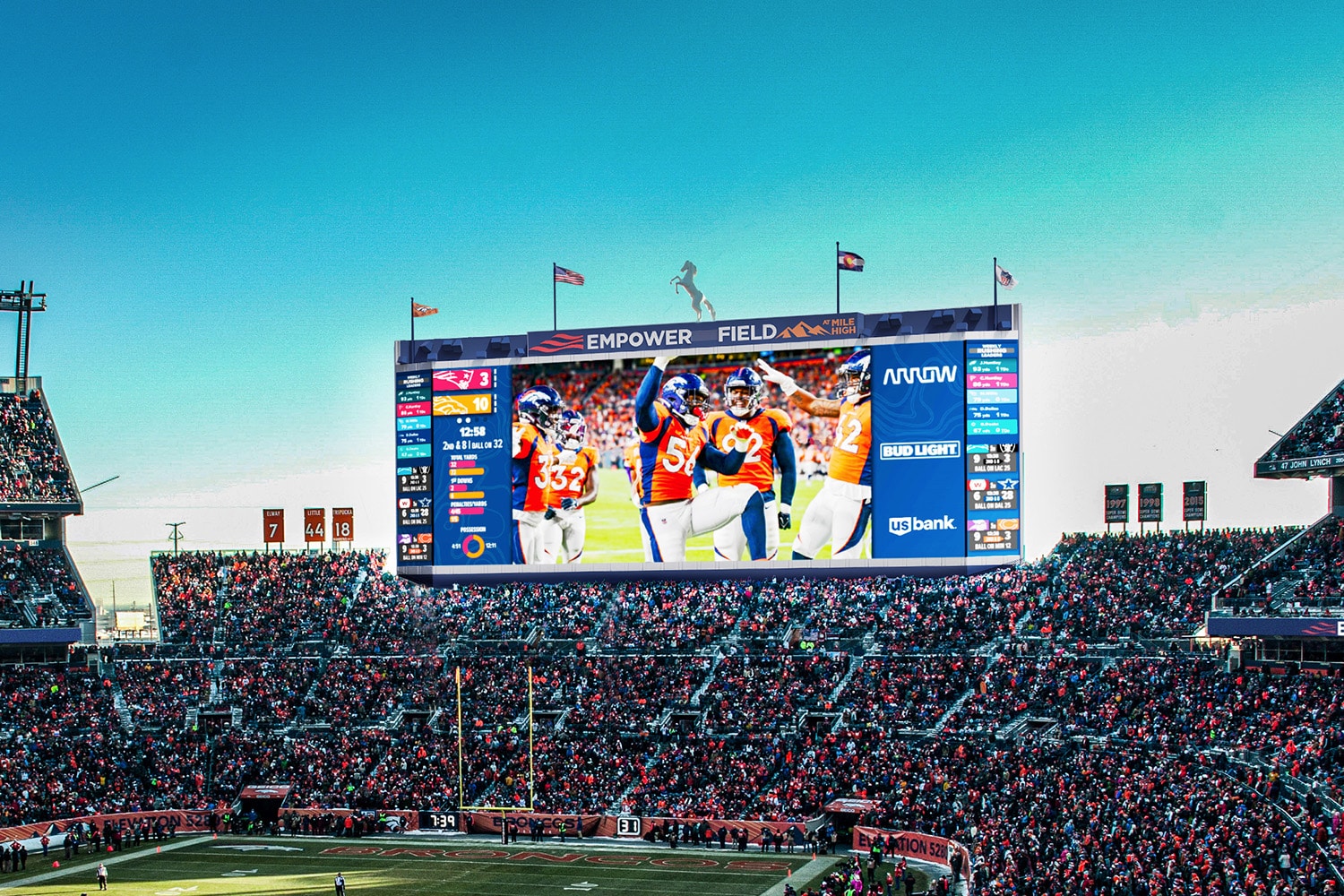 Scoreboard showing highlights and fans cheering at Broncos Stadium in Denver