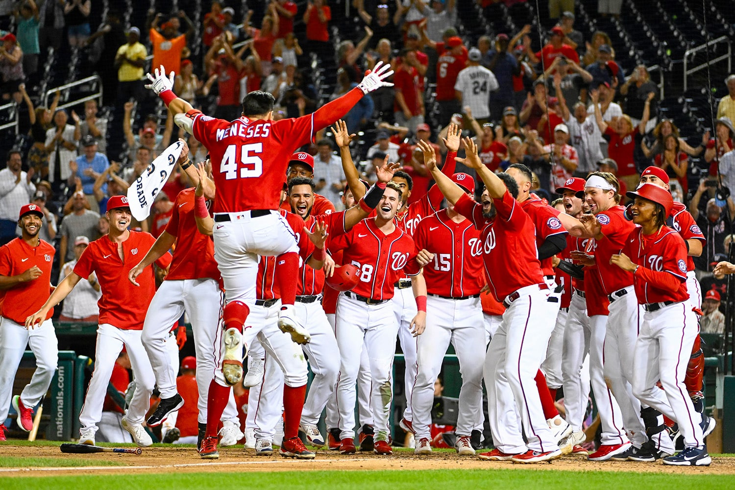 Washington Nationals team celebrates after home run by first baseman Joey Meneses 