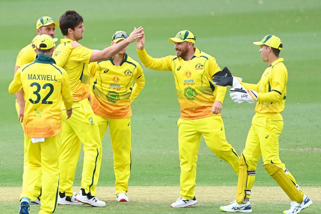 Members of Australia's cricket team warming up before game