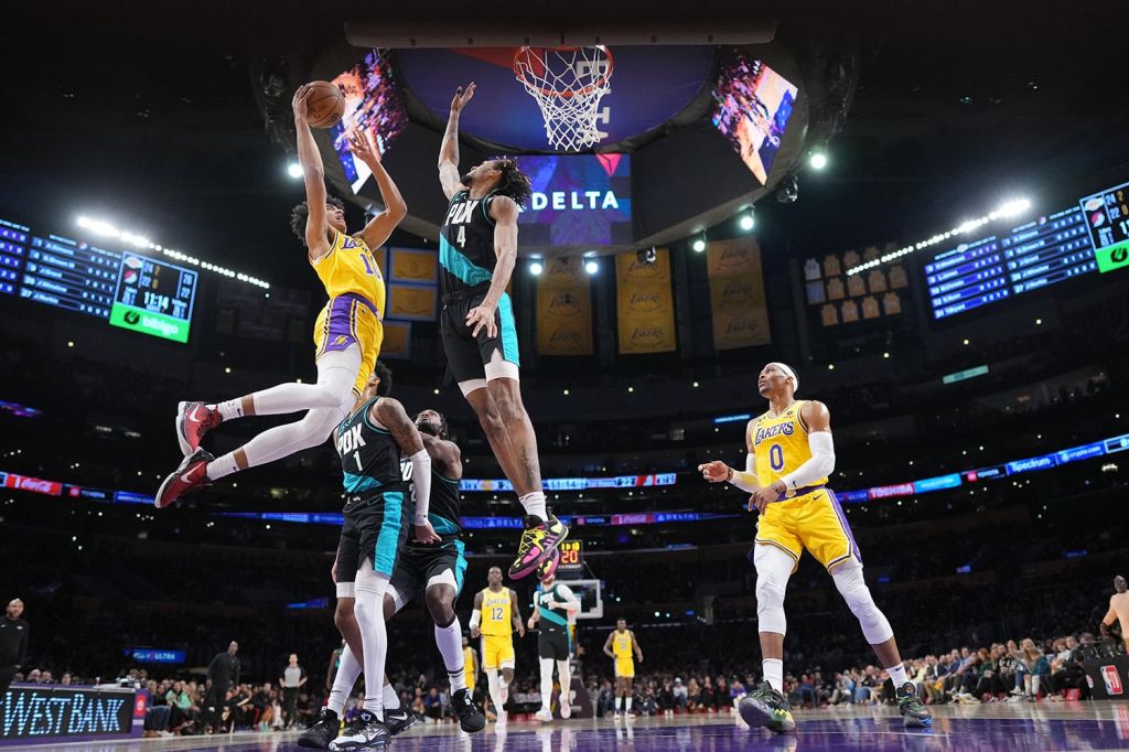 Portland Trailblazers forward contests Los Angeles Lakers shot