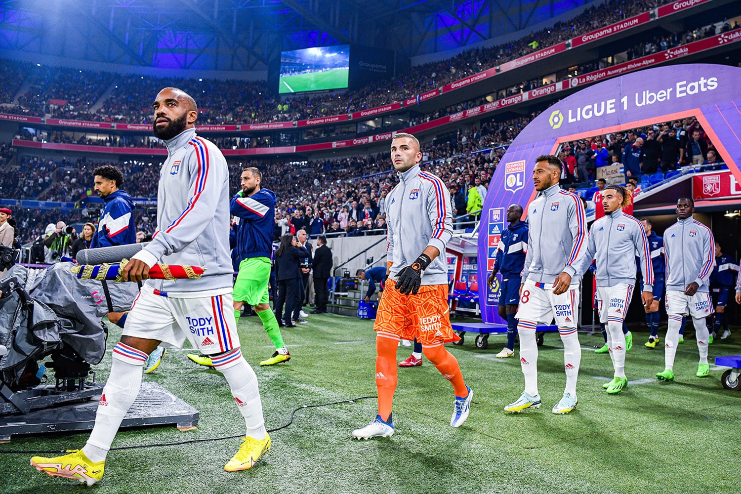 Olympique Lyonnais players walk out of tunnel before league game