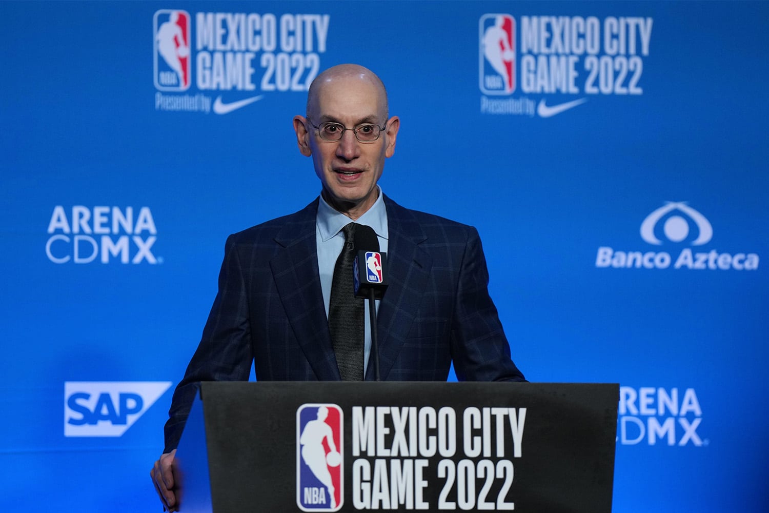 NBA Commissioner Adam Silver speaking at podium ahead of NBA game in Mexico City