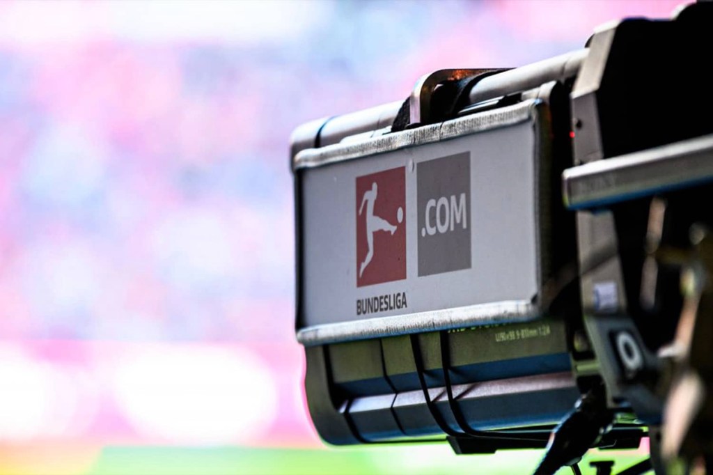 Camera with Bundesliga logo films soccer game