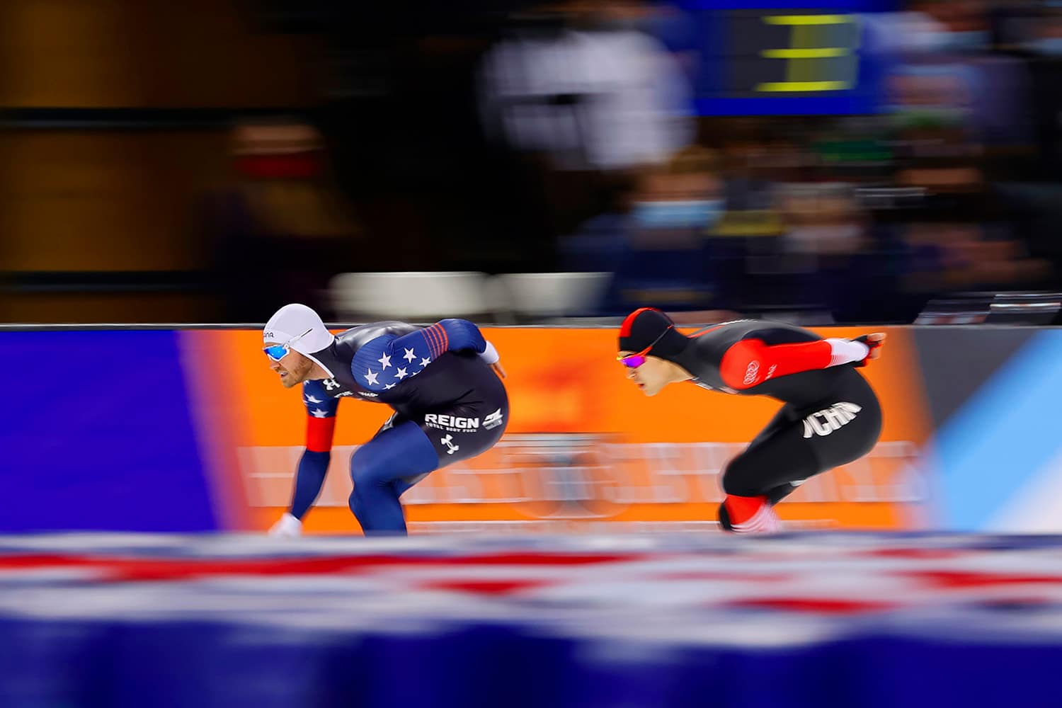 Speed skaters race against one another in Winter Olympic events