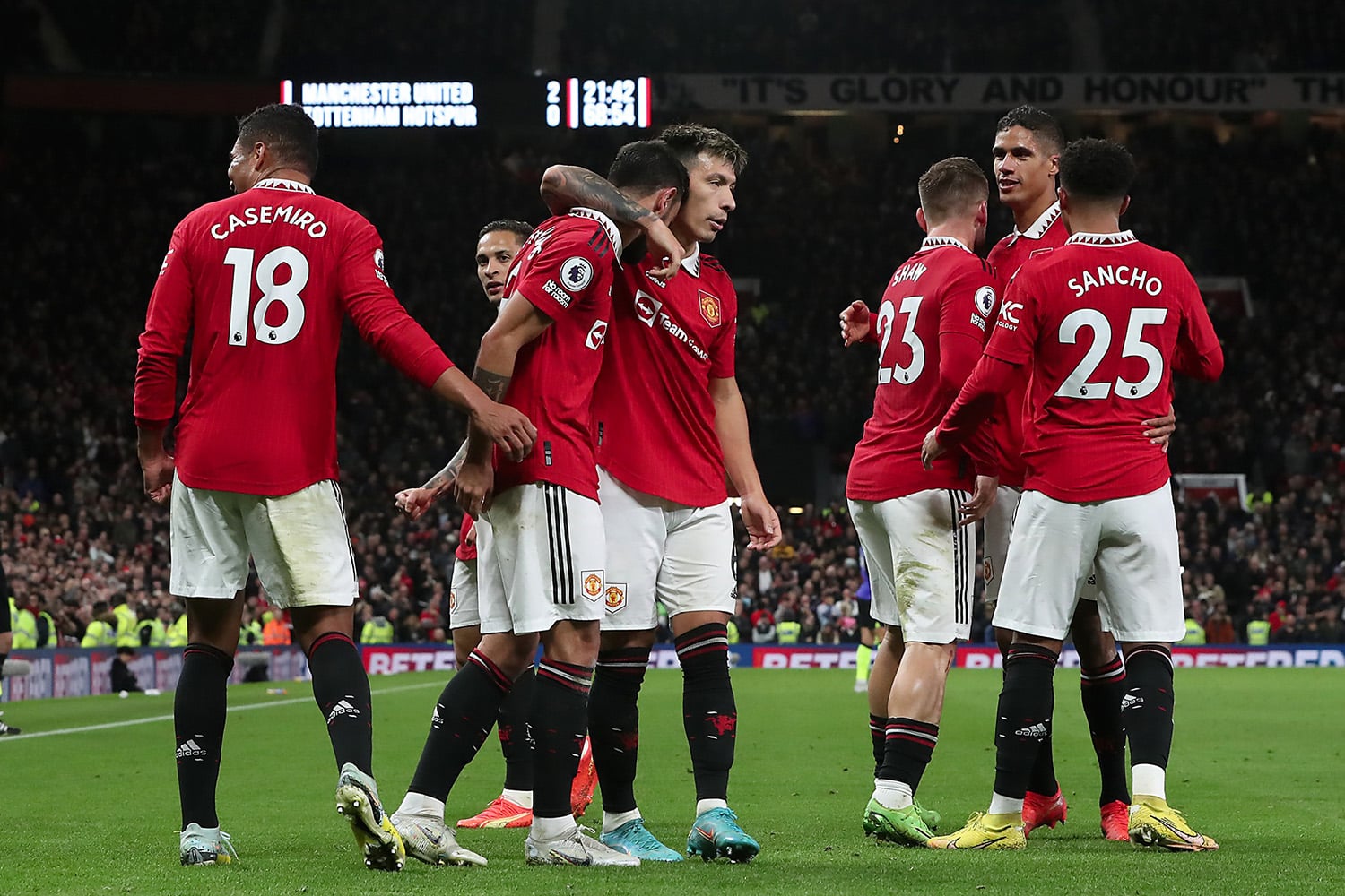 Manchester United players celebrate after scoring a goal against Tottenham Hotspurs