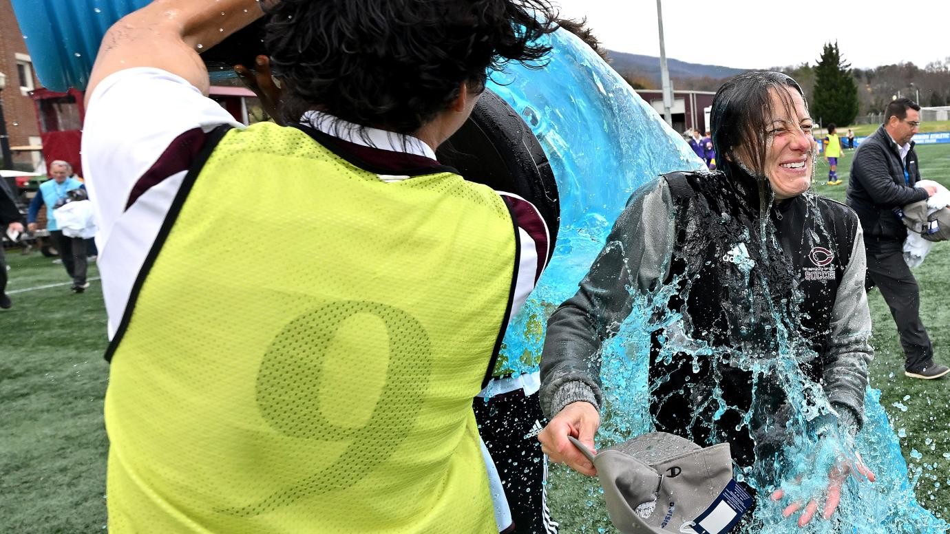 Players pour Gatorade on University of Chicago head coach Julianne Sitch after winning mens D-3 national championship