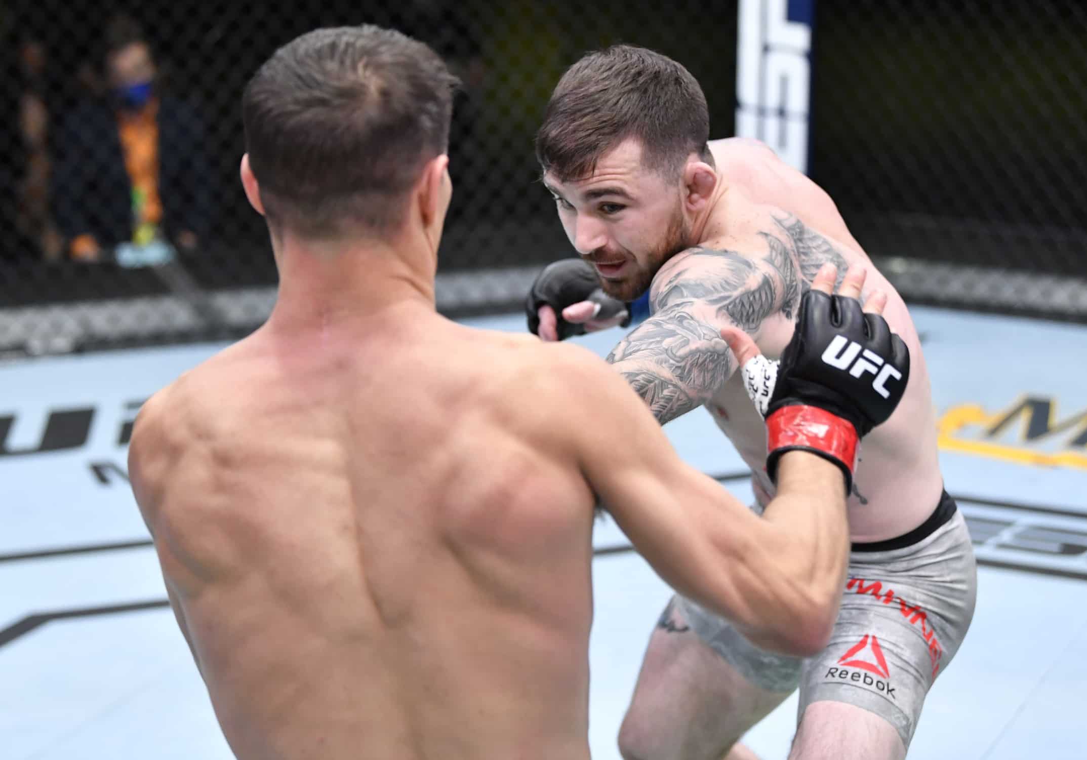 Man dodges punch during a UFC bout