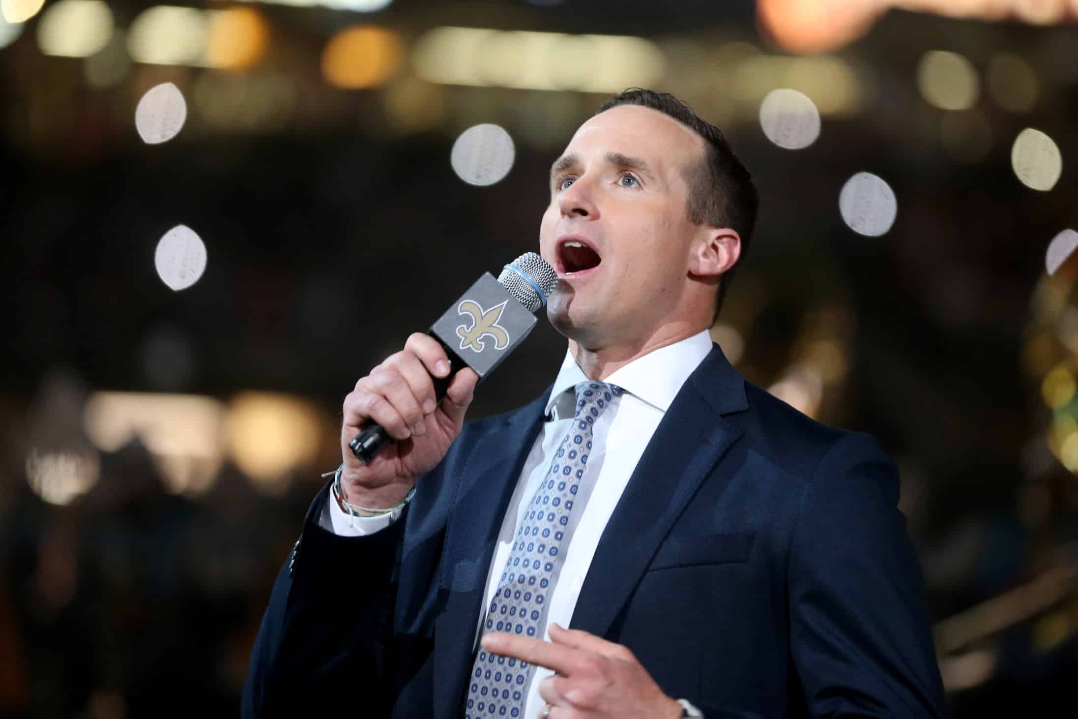 Drew Brees speaking in front of Saints fans