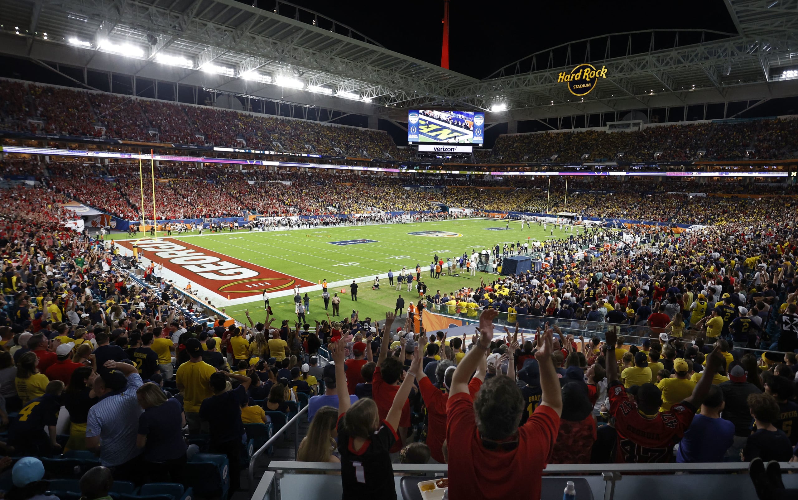 Fans cheer on players during match-up between Georgia and Michigan during 2021 Orange Bowl at Hard Rock Stadium