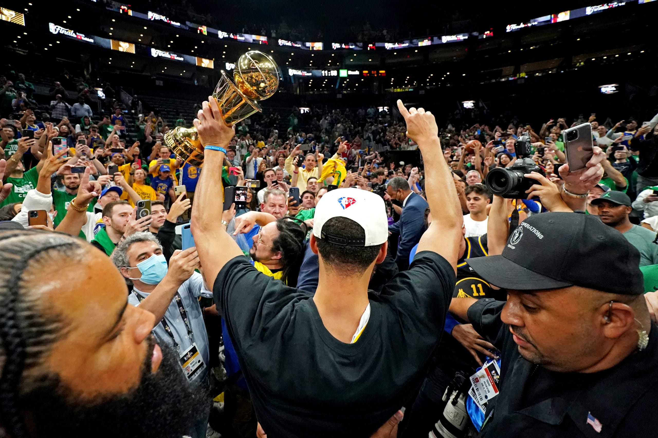 Steph Curry celebrates in front of fans after winning NBA final 
