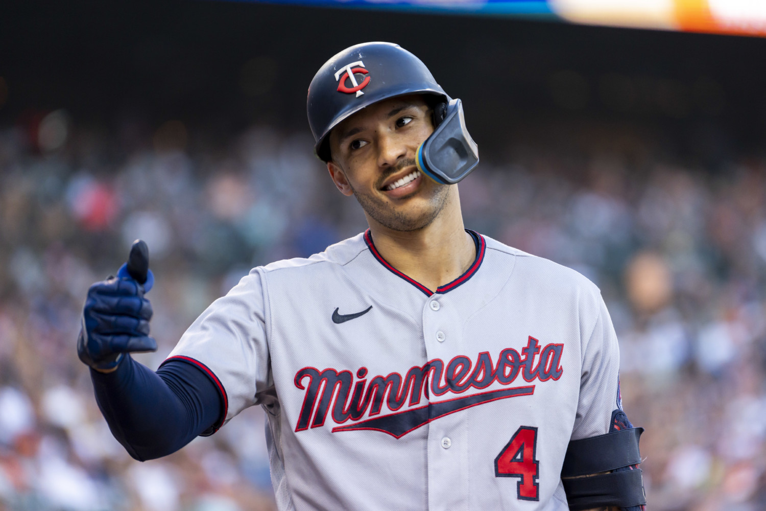 Minnesota Twins shortstop Carlos Correa shows a thumbs-up to bench