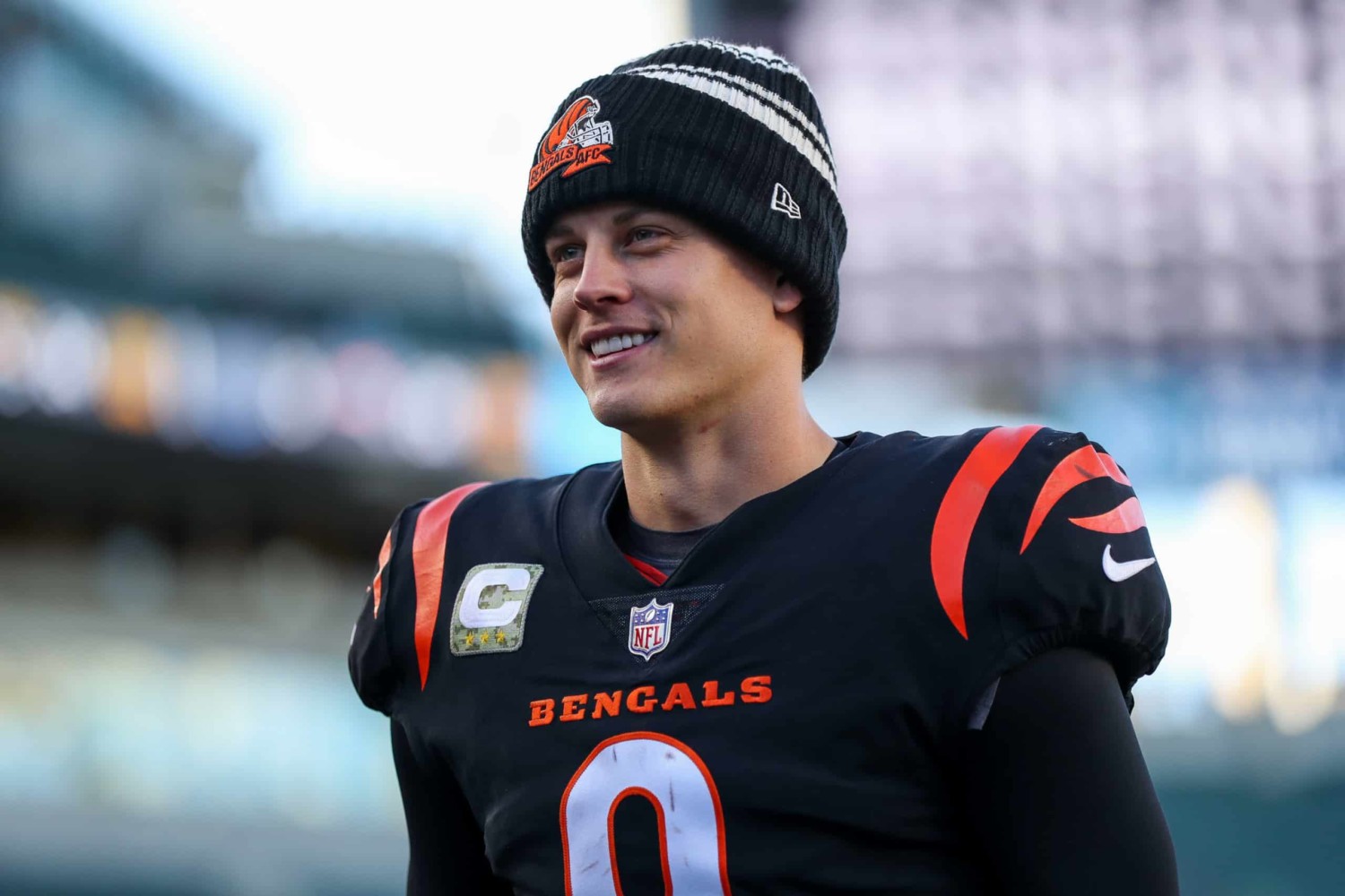 Cincinnati Bengals quarterback Joe Burrow wearing hat on sideline of field