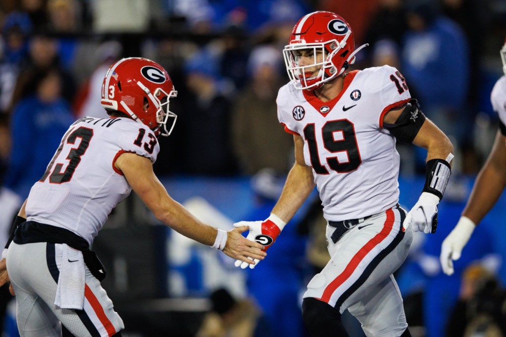 Georgia players Stetson Bennett and Brock Bowers celebrate during game