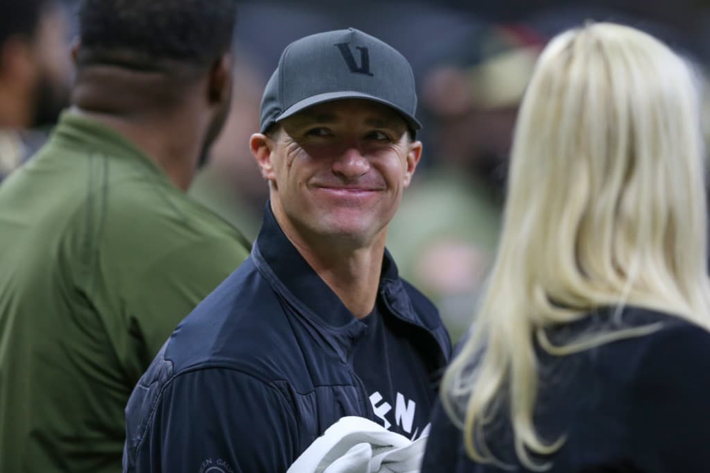Drew Brees smiling while wearing hat