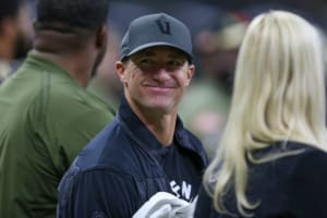 Drew Brees smiling while wearing hat