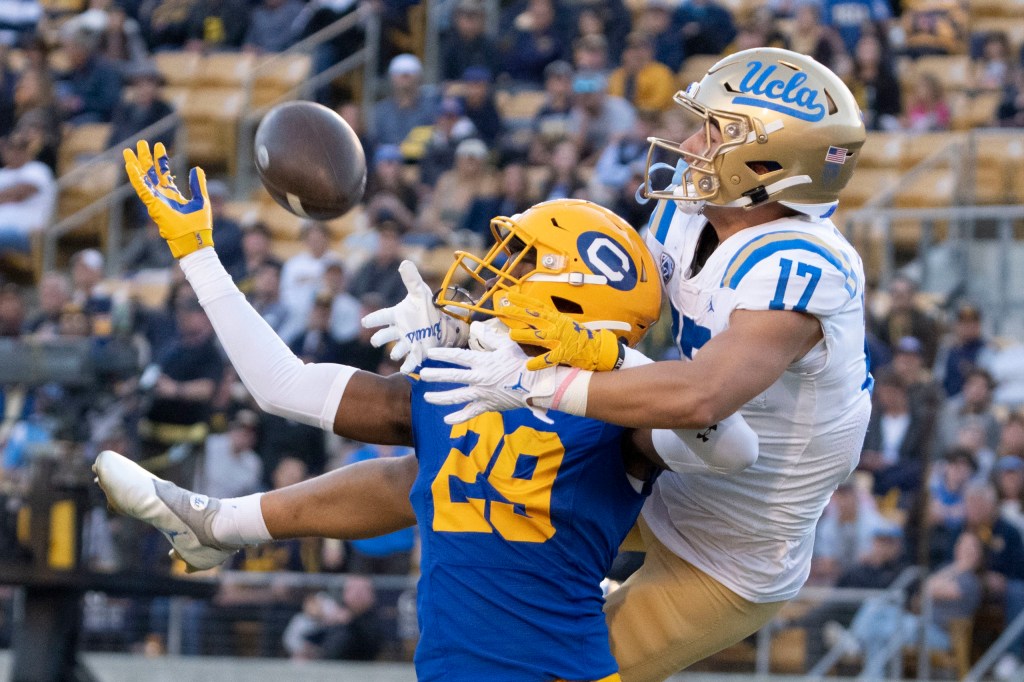 UCLA receiver attempts contested catch against Cal Berkley defender