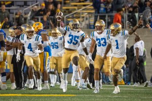UCLA players celebrate after taking ball against Cal Berkley