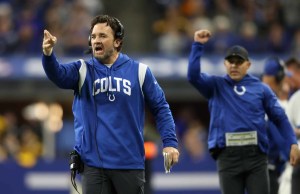 Indianapolis Colts interim head coach Jeff Saturday points down field after gaining a first down